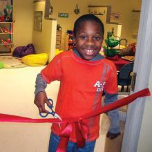BCDD opening for clients with child cutting a ribbon